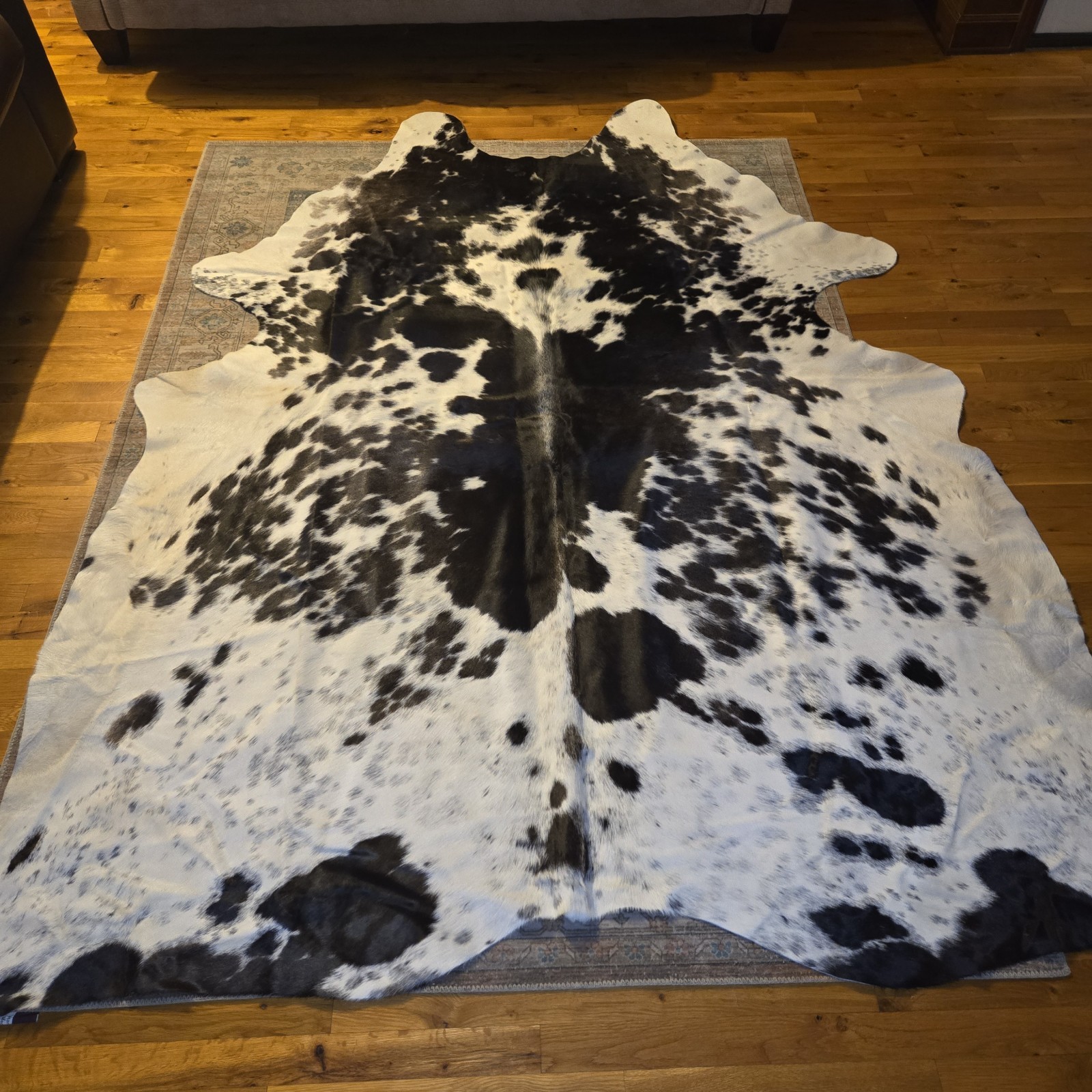 Abhinav 6′ x 7′ Black and White Cowhide Cowhide Area Rug