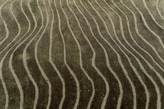 Pile Height Varies Between 12-14 mm which Means its supremely Cozy tufted rugs
