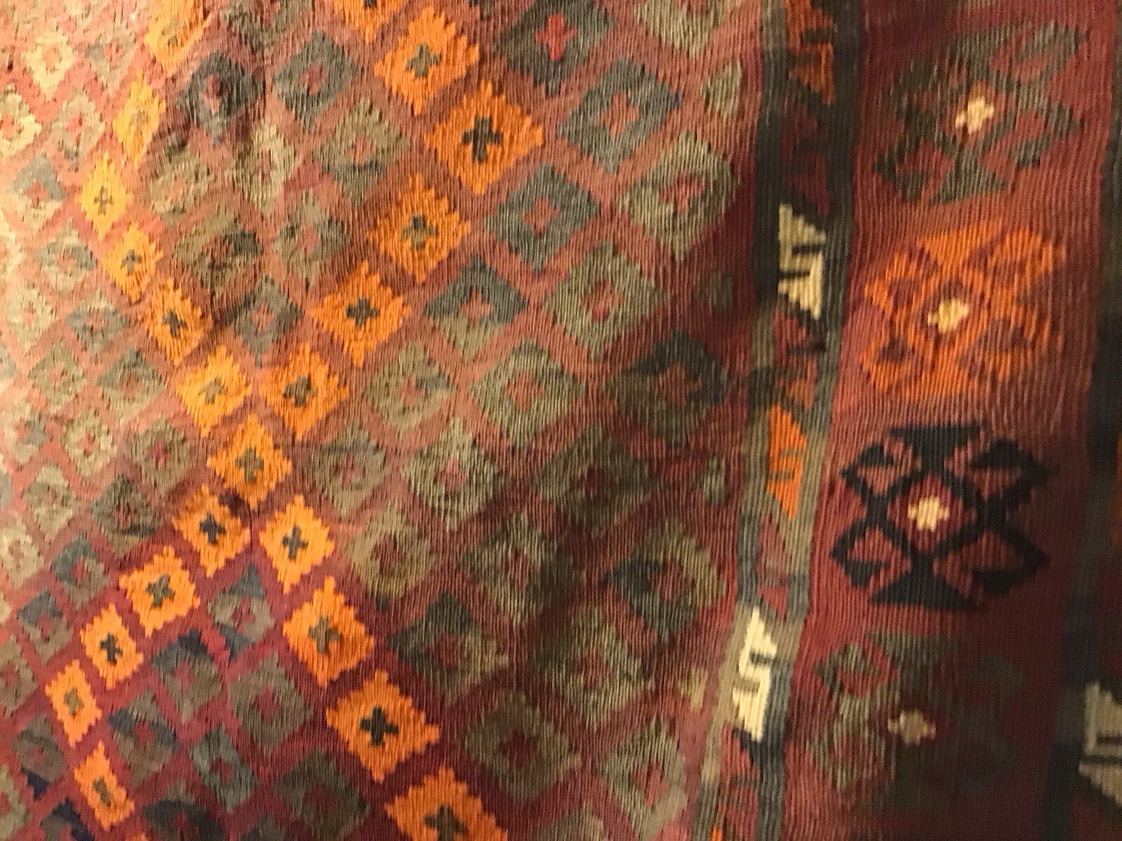 Accent Rug Orange Black and Rust White Color 6’10” long by 3’ 10” wide