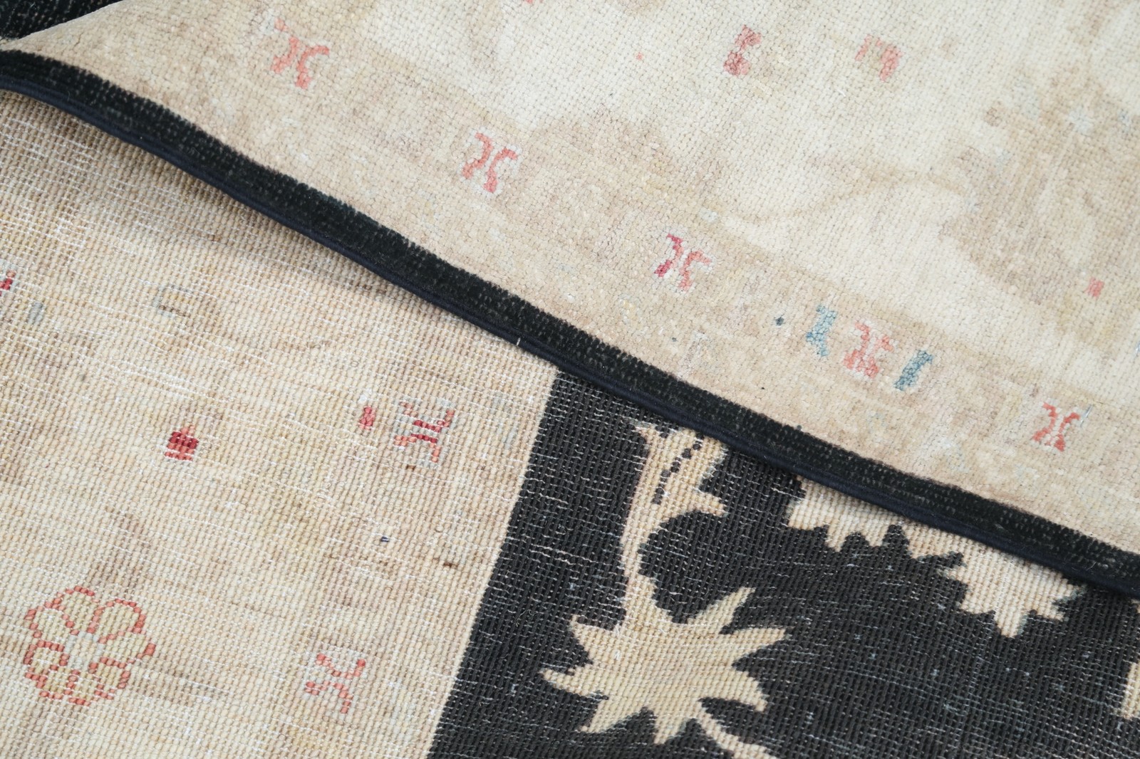5.7×8 ft Hand Knotted Floral Area Rug with Black Field and Beige Border