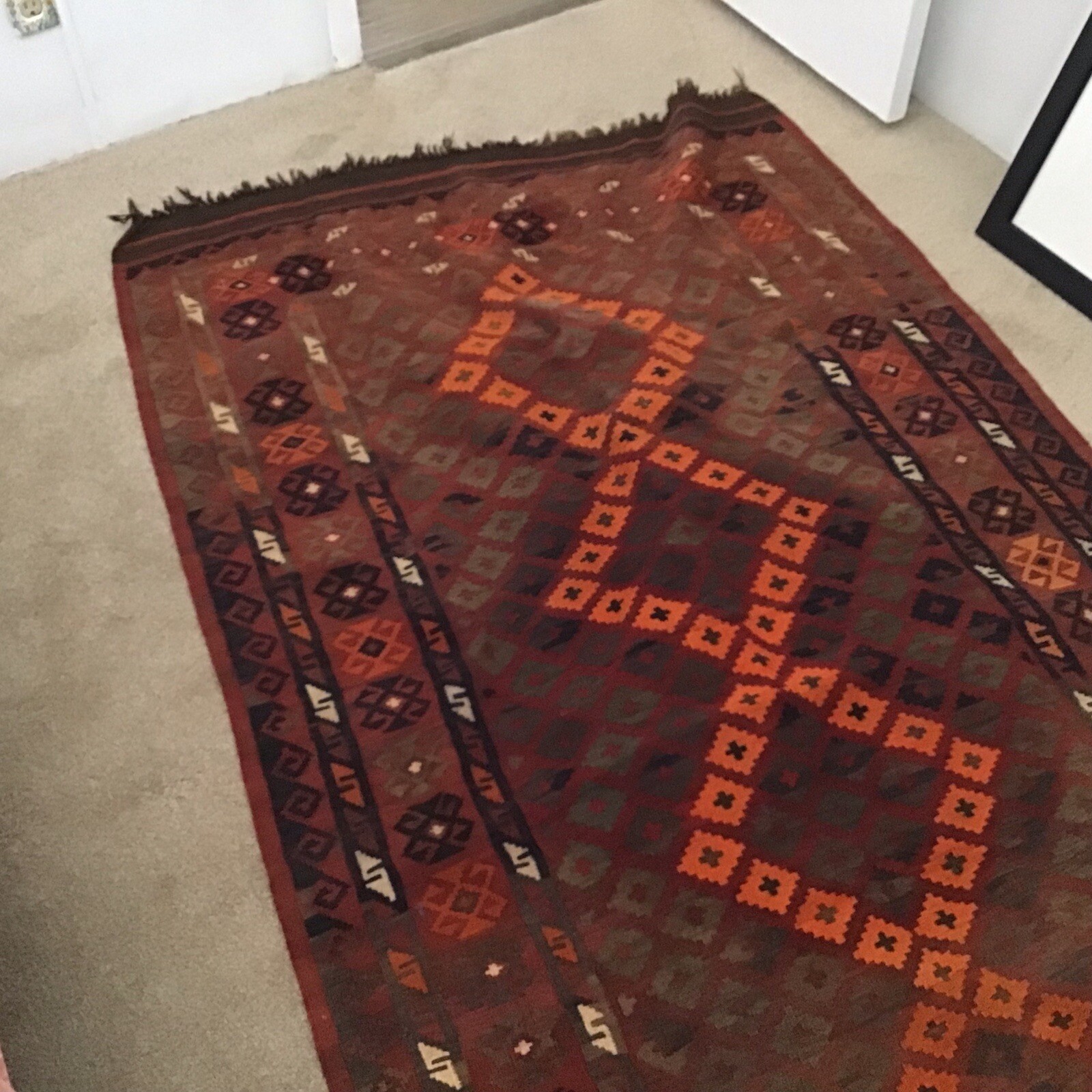 Accent Rug Orange Black and Rust White Color 6’10” long by 3’ 10” wide