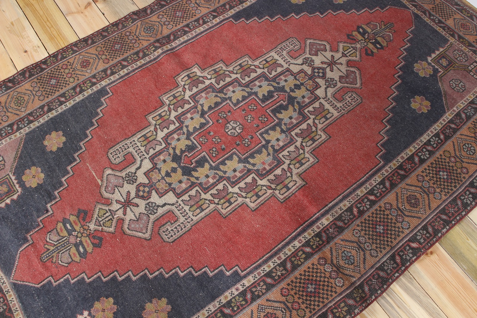 Vintage Turkish Area Rug 4,8×7,7 ft, Red Blue Geometric Rug
