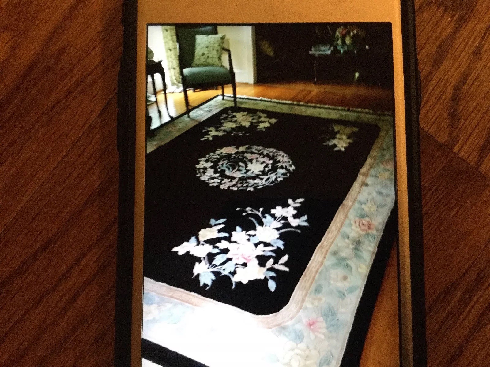 Black, white, teal and pink floral oriental area rug 102″ x 116″.