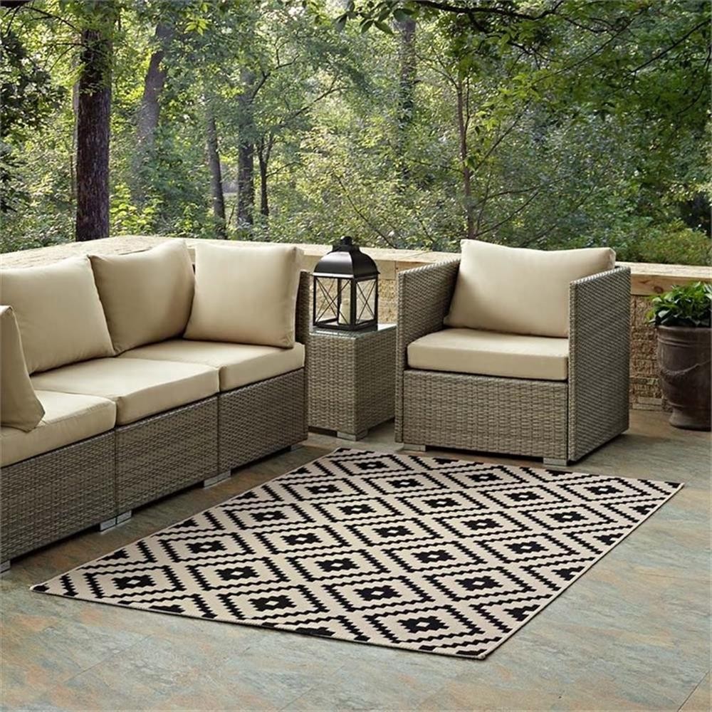 Pemberly Row 94.5×122″ Geometric Diamond Trellis Area Rug in Black and Beige