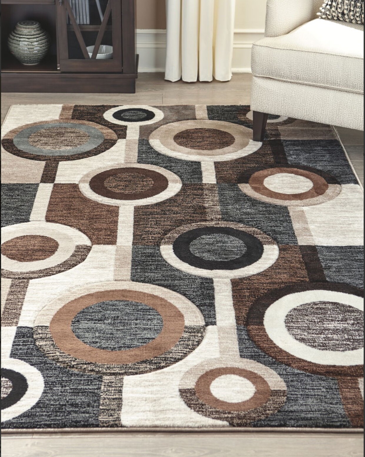 Ashley Furniture Guintte 5’x 7’ Medium Pile Multilayered Rug in Black and Brown