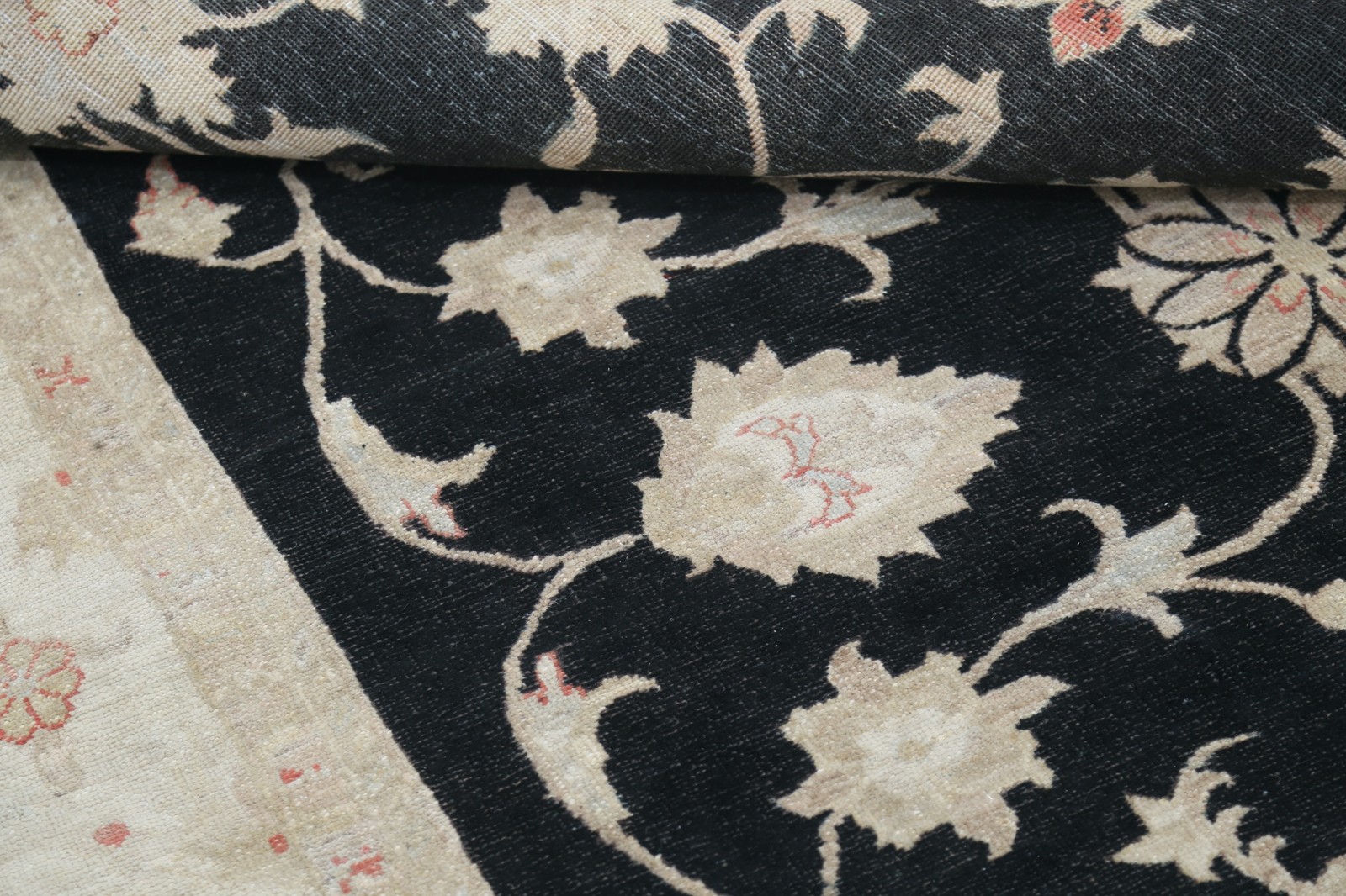 5.7×8 ft Hand Knotted Floral Area Rug with Black Field and Beige Border