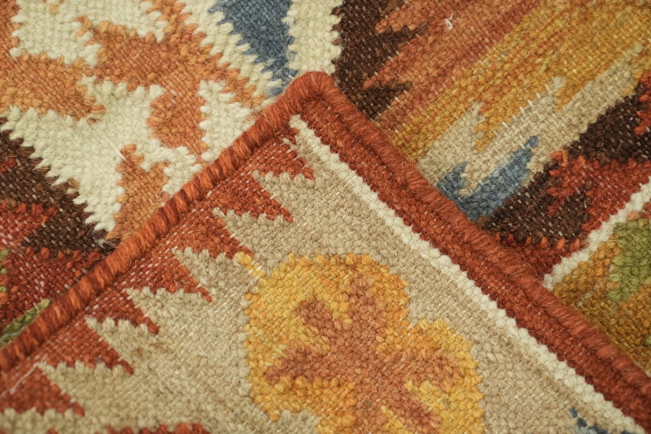Earthy Hues Meet Traditional Motifs in 5×8 Modern Tribal Rug