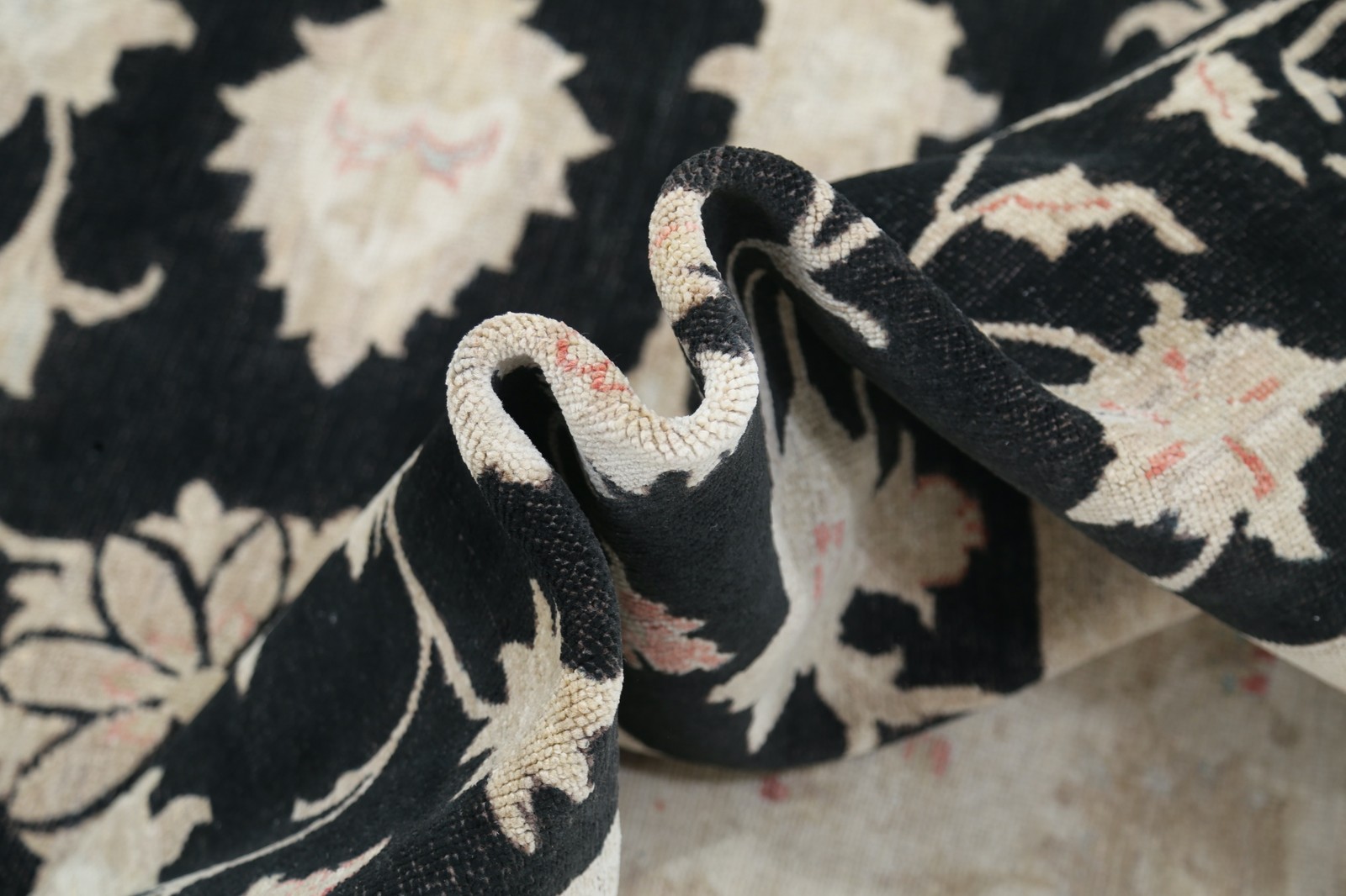 5.7×8 ft Hand Knotted Floral Area Rug with Black Field and Beige Border