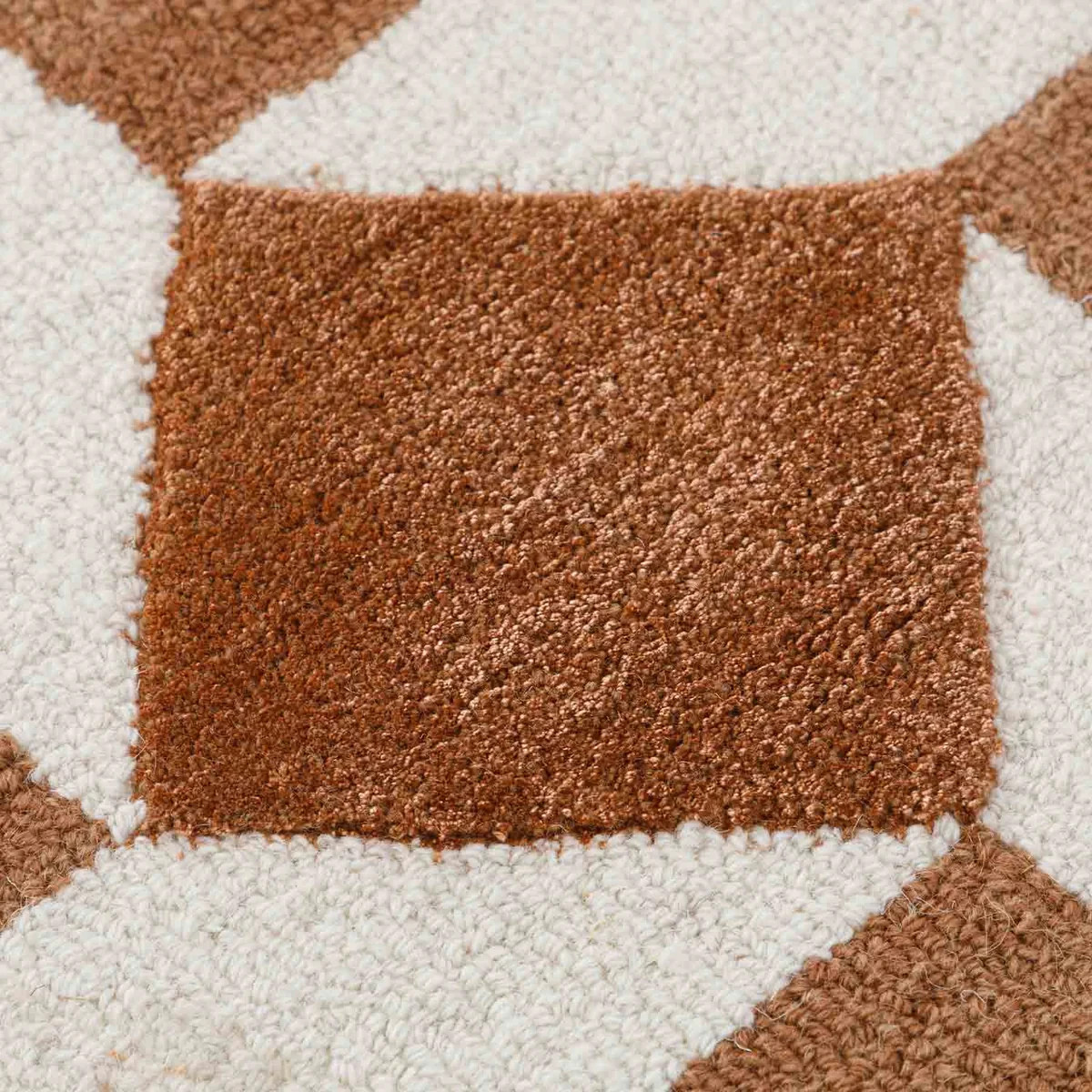 Hand tuftedabstract design in shades of brown will now be elevating the comfort