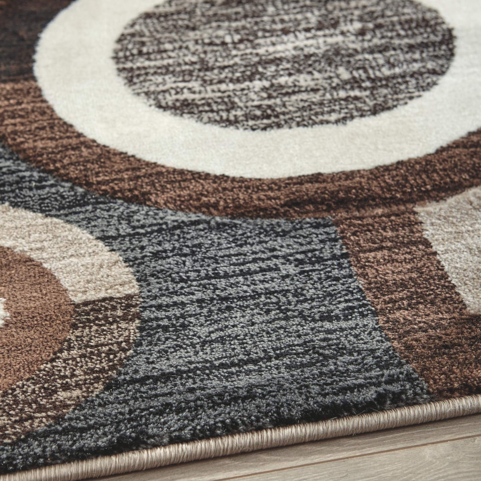 Ashley Furniture Guintte 8’2″ x 9’6″ Rug in Black and Brown