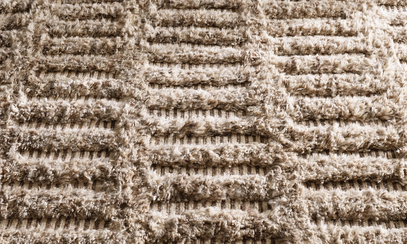 Dashed lines appear hewn into Allali’s plush pile, the meditative grid Moroccan