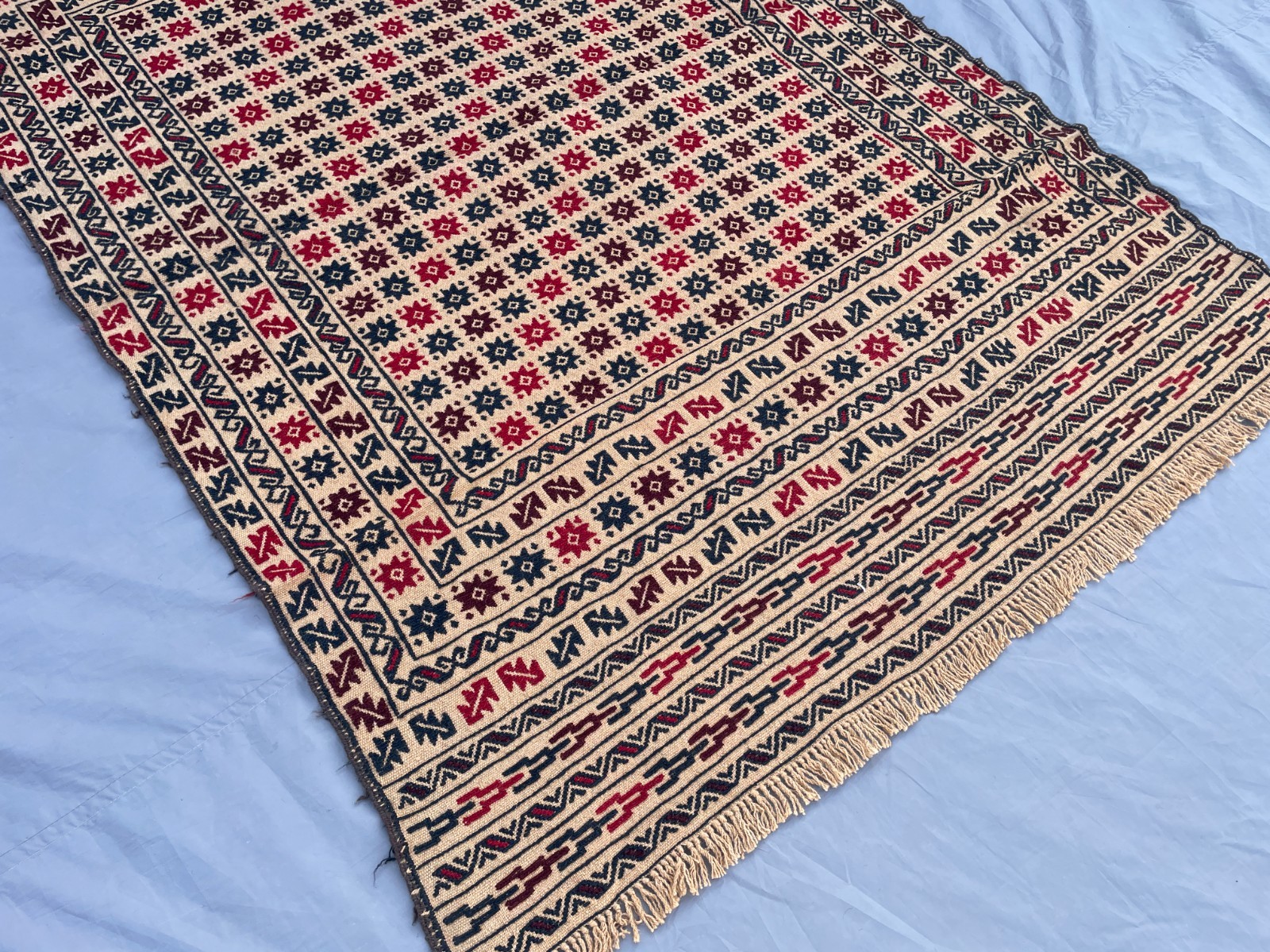 4×6 Ivory Afghan Kilim Rug with Repeating Star Motifs and Layered Tribal Borders