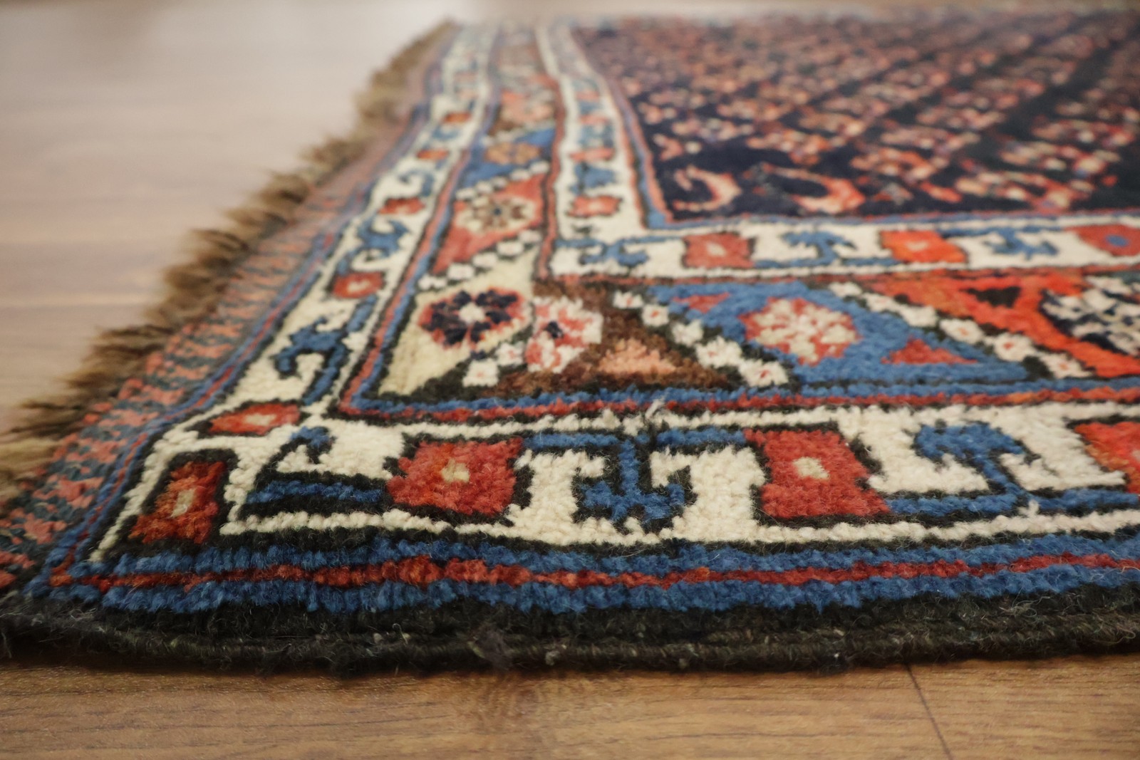Classic Vintage Wool 5×9 Area Rug in All-Over Geometry Deep Black & Red Tones