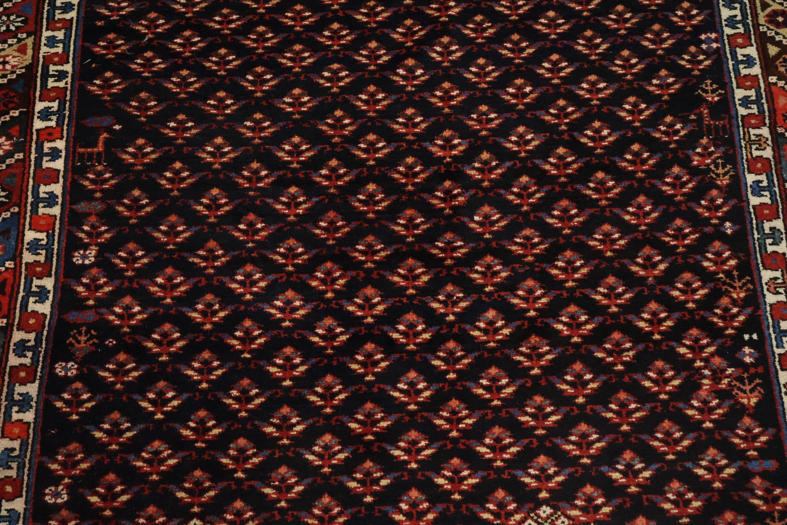 Classic Vintage Wool 5×9 Area Rug in All-Over Geometry Deep Black & Red Tones